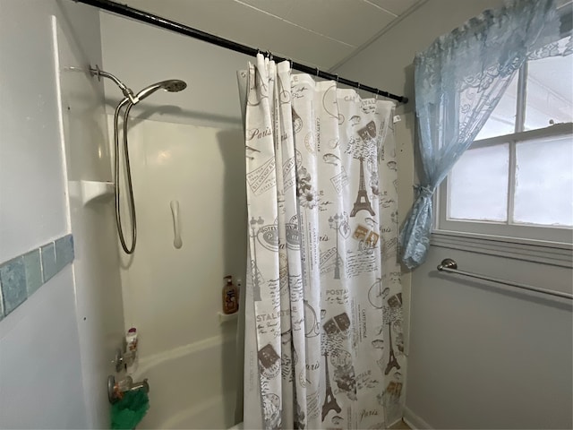 bathroom featuring shower / bath combination with curtain