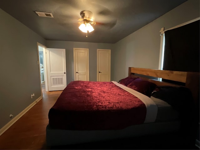 bedroom featuring ceiling fan and dark hardwood / wood-style floors