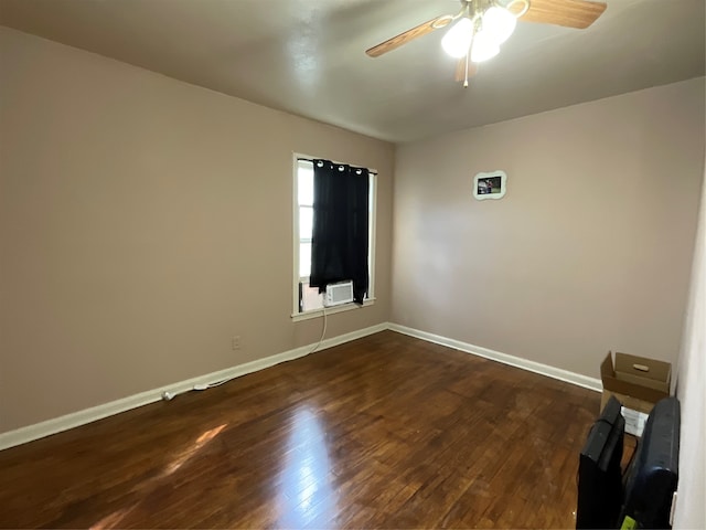 spare room featuring dark hardwood / wood-style floors and ceiling fan