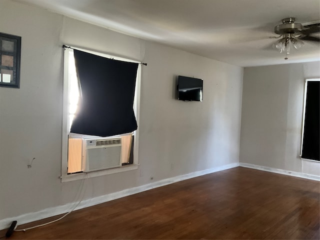 unfurnished living room with dark hardwood / wood-style floors and ceiling fan