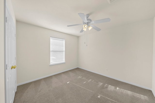 spare room with ceiling fan and carpet floors