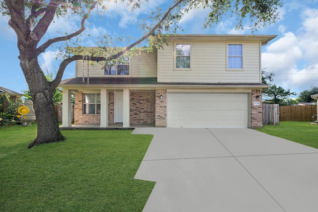 view of property with a front yard and a garage