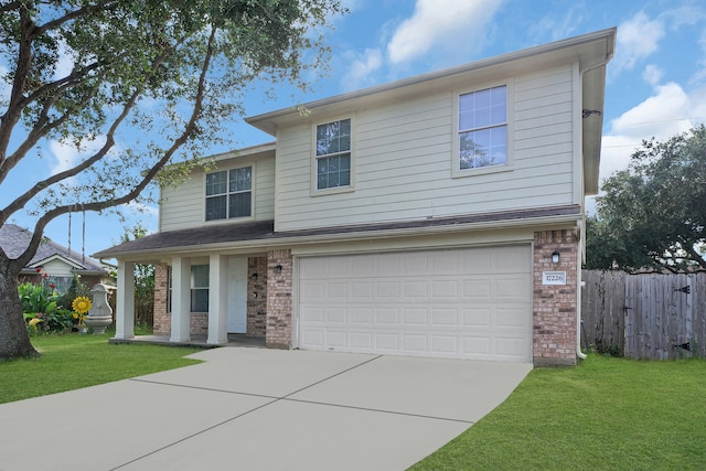 view of front property featuring a front yard and a garage