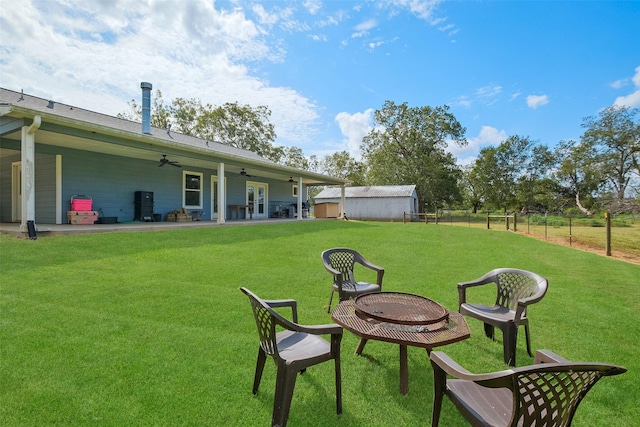 10723 Fm 442nd Rd, Boling, TX 77420 - view of yard with a ceiling fan and a fire pit