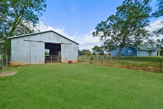 10723 Fm 442nd Rd, Boling, TX 77420 - view of yard featuring an outdoor structure, an outbuilding, and an exterior structure