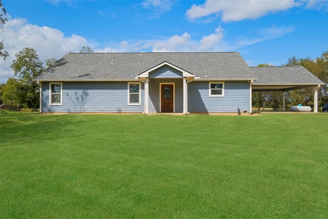 10723 Fm 442nd Rd, Boling, TX 77420 - view of front of property with a front lawn, roof with shingles, and a carport