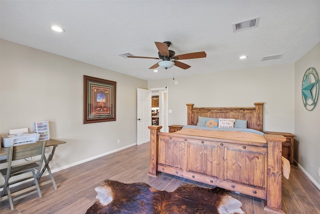 bedroom featuring ceiling fan and wood-type flooring