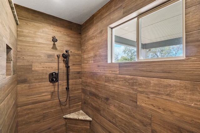 bathroom with tiled shower