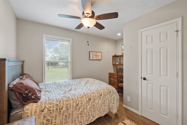 bedroom with wood-type flooring and ceiling fan