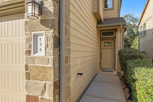 property entrance with a garage