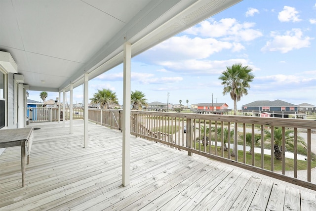 wooden deck featuring a residential view