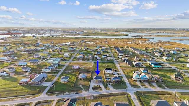 bird's eye view with a water view and a residential view