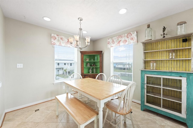 dining room featuring light tile patterned floors, a chandelier, recessed lighting, and baseboards