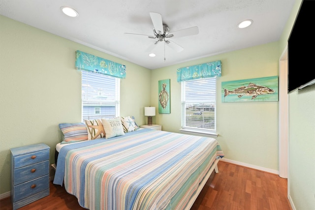 bedroom with wood finished floors, ceiling fan, recessed lighting, and baseboards