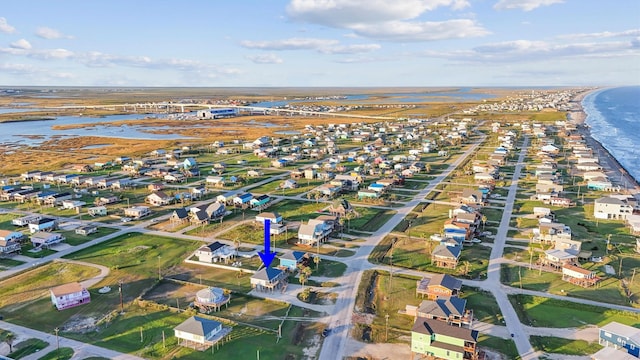 birds eye view of property with a residential view and a water view