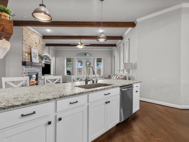 kitchen featuring sink, pendant lighting, stainless steel dishwasher, white cabinets, and dark hardwood / wood-style floors