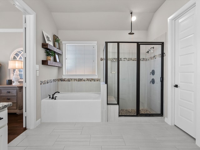 bathroom featuring vanity, plus walk in shower, and vaulted ceiling