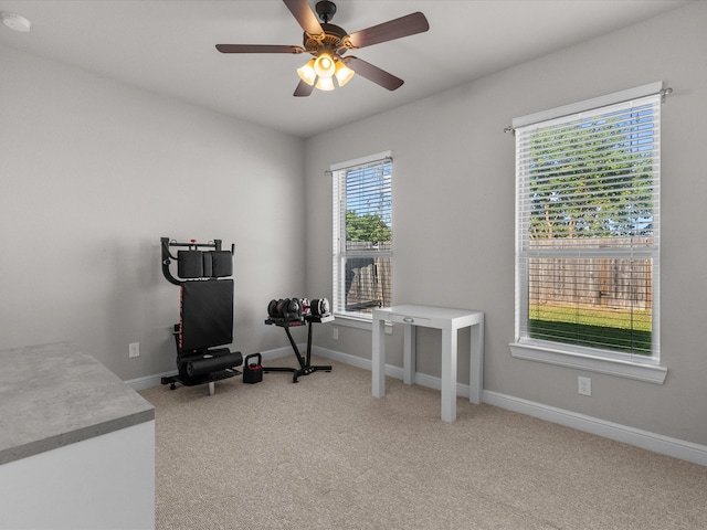 exercise room featuring carpet floors and ceiling fan