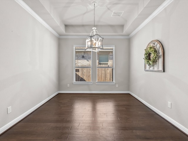 unfurnished dining area with a wealth of natural light, crown molding, and a tray ceiling