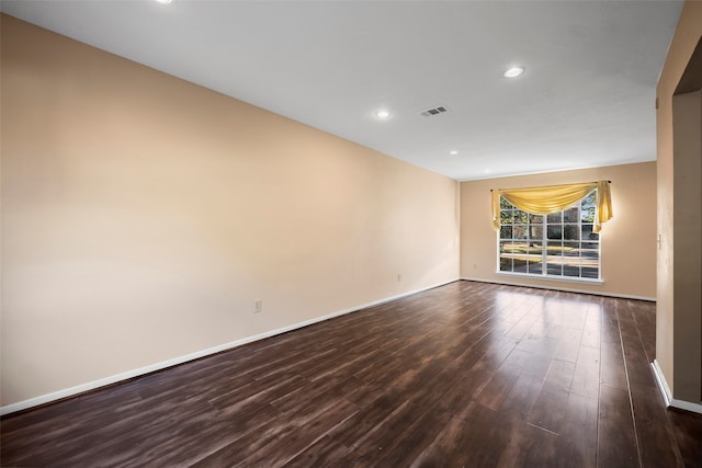 unfurnished room featuring dark hardwood / wood-style floors