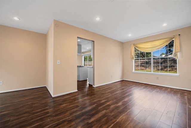 empty room with dark hardwood / wood-style floors