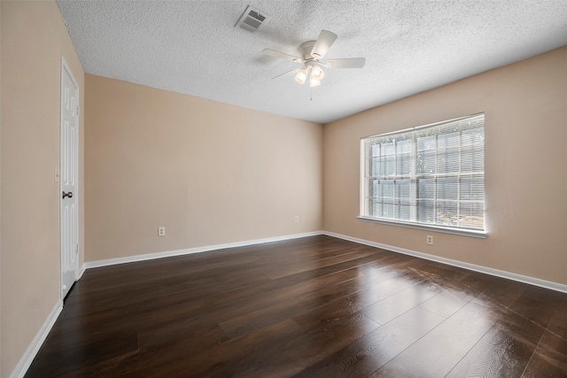 unfurnished room featuring ceiling fan, a textured ceiling, and dark hardwood / wood-style floors