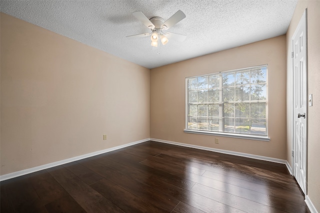 spare room with a textured ceiling, ceiling fan, and dark hardwood / wood-style flooring