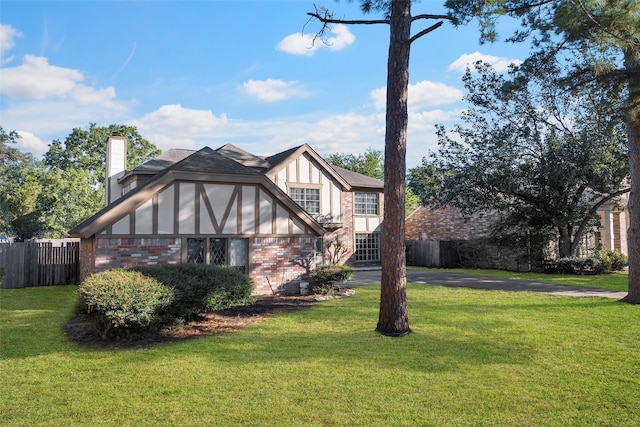 view of side of property with a yard