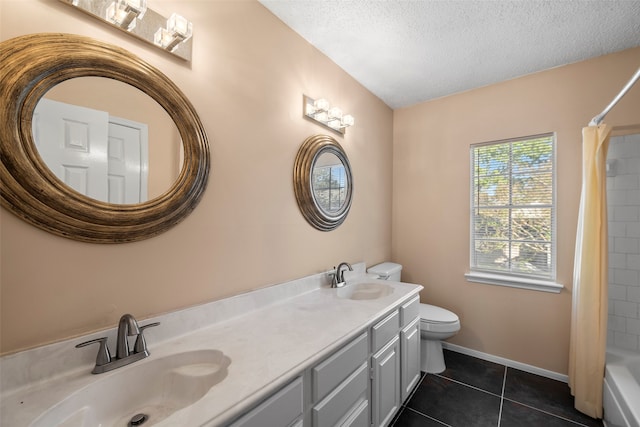 full bathroom with shower / bath combination with curtain, a textured ceiling, toilet, vanity, and tile patterned floors