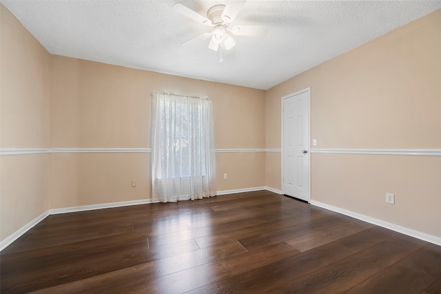 spare room with a textured ceiling, dark hardwood / wood-style floors, and ceiling fan