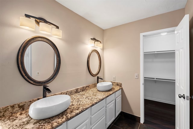 bathroom featuring vanity and hardwood / wood-style flooring