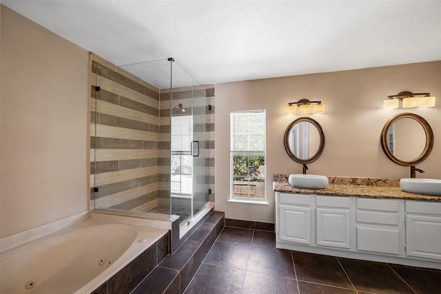 bathroom featuring vanity, plus walk in shower, and tile patterned flooring