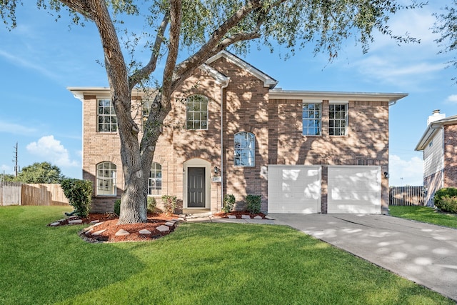 view of front facade with a garage and a front lawn