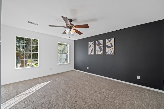 carpeted empty room with ceiling fan