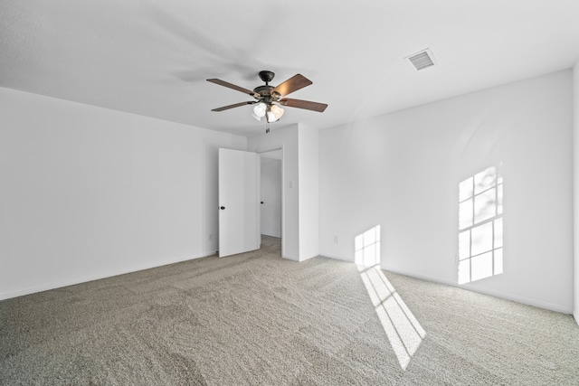 carpeted empty room with ceiling fan