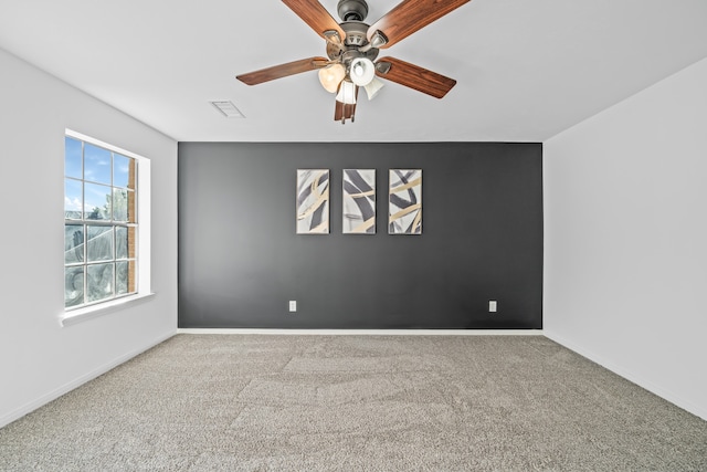 carpeted empty room with ceiling fan