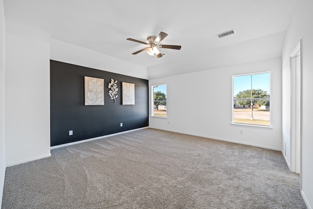 carpeted empty room featuring ceiling fan