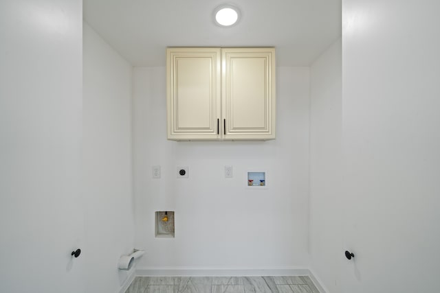 laundry room with hookup for a washing machine, hookup for a gas dryer, hookup for an electric dryer, and cabinets