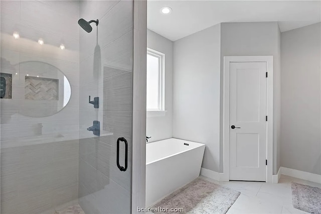 bathroom with shower with separate bathtub