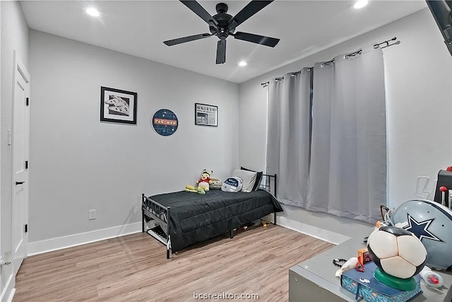 bedroom featuring light wood-type flooring and ceiling fan