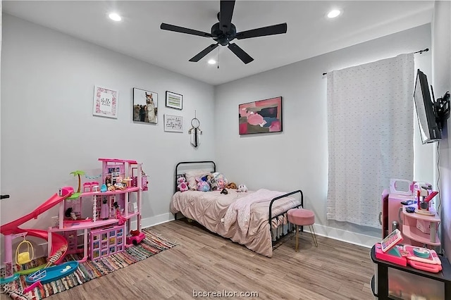 bedroom with hardwood / wood-style flooring and ceiling fan