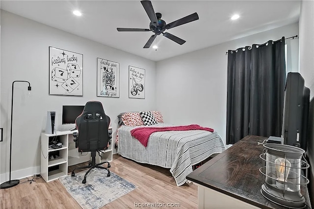 bedroom featuring wood-type flooring and ceiling fan