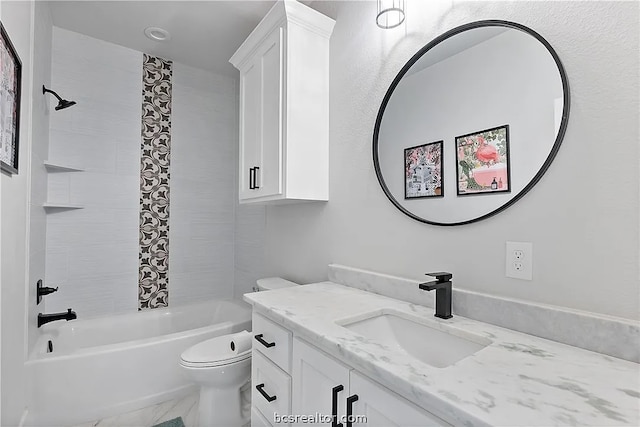 full bathroom featuring toilet, tiled shower / bath, and vanity