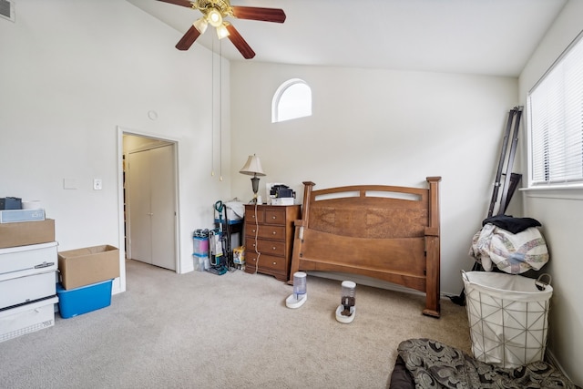 bedroom featuring light carpet, high vaulted ceiling, and ceiling fan