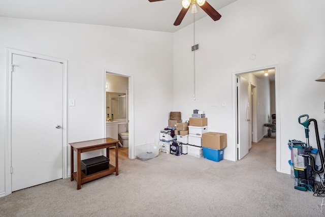 misc room featuring ceiling fan, high vaulted ceiling, and light colored carpet