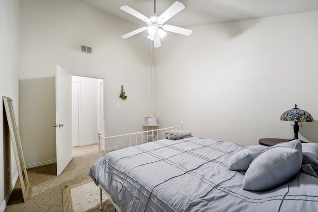 bedroom with light carpet, high vaulted ceiling, and ceiling fan