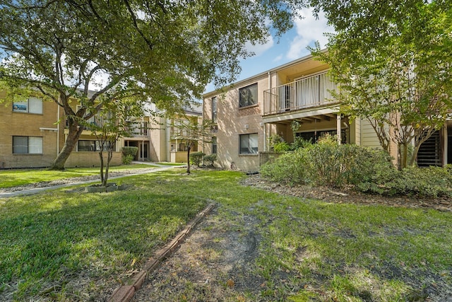 view of home's community with a lawn