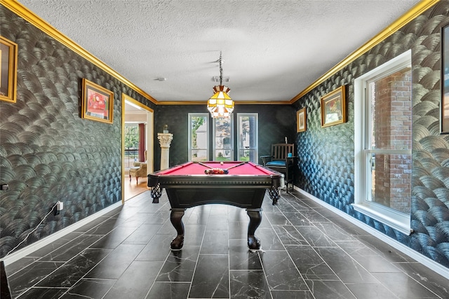 game room with pool table, crown molding, and a textured ceiling