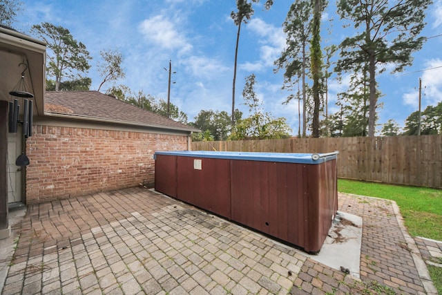 view of patio with a hot tub