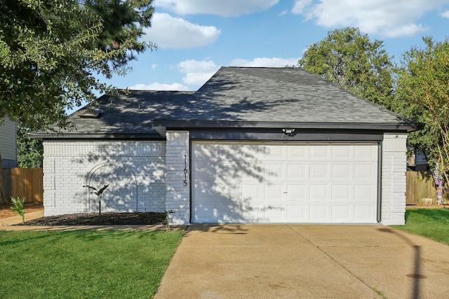 garage featuring a yard